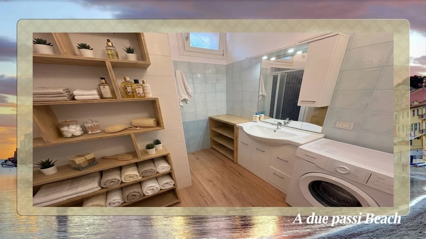 Bagno con scaffalatura, lavabo e lavatrice - Due Passi Beach Sestri Levante